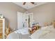 Neutral bedroom with a teddy bear, a window, a ceiling fan, and wood-look flooring at 7115 E Olla Ave, Mesa, AZ 85212