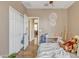 Neutral bedroom with a teddy bear, a window, a ceiling fan, and wood-look flooring at 7115 E Olla Ave, Mesa, AZ 85212