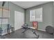 Home exercise room including bench, exercise ball, weights and inspirational wall art at 7115 E Olla Ave, Mesa, AZ 85212