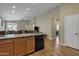 Bright, open kitchen with granite countertops and views of living spaces at 7115 E Olla Ave, Mesa, AZ 85212