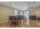 Bright living room featuring wood floors, ceiling fan, and sliding glass doors at 7115 E Olla Ave, Mesa, AZ 85212