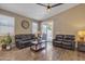 Inviting living room featuring hardwood floors, ceiling fan, recessed lights, and sliding door to patio at 7115 E Olla Ave, Mesa, AZ 85212