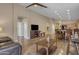 Spacious open-concept living area boasts hardwood floors, recessed lighting, fireplace, and natural light at 7115 E Olla Ave, Mesa, AZ 85212