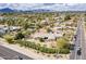 Panoramic view of a home showcasing its generous lot and its proximity to local streets, with a mountain backdrop at 7131 E Cholla St, Scottsdale, AZ 85254