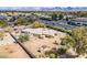 High angle shot of a single-Gathering house with a large backyard, surrounded by greenery and neighborhood streets at 7131 E Cholla St, Scottsdale, AZ 85254