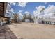 Large backyard with palm trees, gravel, and two storage sheds at 7131 E Cholla St, Scottsdale, AZ 85254