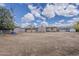 Expansive backyard awaiting transformation, with a view of the rear of the home and ample space for outdoor activities at 7131 E Cholla St, Scottsdale, AZ 85254