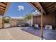 Enclosed patio with brick flooring, block wall, and mini-split air conditioners at 7131 E Cholla St, Scottsdale, AZ 85254