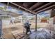 Covered patio extending to a large backyard with outdoor cooking space, perfect for entertaining at 7131 E Cholla St, Scottsdale, AZ 85254