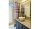 Well-lit bathroom with a modern vessel sink, granite countertops, and a tub-shower combo at 7750 E Broadway Rd # 433, Mesa, AZ 85208