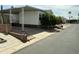Home featuring mature trees and convenient carport parking at 7750 E Broadway Rd # 433, Mesa, AZ 85208