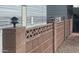 This homes exterior features a brick privacy fence with custom lighting at 7750 E Broadway Rd # 433, Mesa, AZ 85208