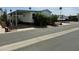 Home features a large carport and mature landscaping at 7750 E Broadway Rd # 433, Mesa, AZ 85208
