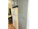 A kitchen features a white refrigerator situated next to painted blue cabinets, offering ample storage space at 7750 E Broadway Rd # 433, Mesa, AZ 85208