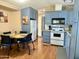 Efficient kitchen with light blue cabinets, dining area, and modern appliances at 7750 E Broadway Rd # 433, Mesa, AZ 85208