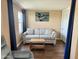 Relaxing living room features a sofa, accent table, and neutral tones for a serene space at 7750 E Broadway Rd # 433, Mesa, AZ 85208