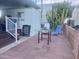 Charming outdoor patio area with a glass table, chairs, privacy fence, and relaxing ambiance at 7750 E Broadway Rd # 433, Mesa, AZ 85208