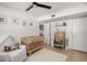 Charming Bedroom with wooden crib, ceiling fan, and bright, neutral decor at 7811 N 32Nd Ave, Phoenix, AZ 85051