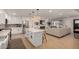 Open-concept kitchen and living area featuring an island with bar seating, stainless appliances, and lots of light at 7811 N 32Nd Ave, Phoenix, AZ 85051