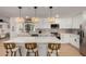 Modern kitchen featuring white cabinetry, stainless steel appliances, and a spacious island with bar seating at 7811 N 32Nd Ave, Phoenix, AZ 85051