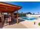 Inviting pool area with covered patio and outdoor seating at 7811 N 32Nd Ave, Phoenix, AZ 85051