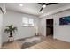 Inviting room featuring wood floors, a modern lamp, and light airy window at 7811 N 32Nd Ave, Phoenix, AZ 85051