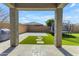 A covered patio leads to a backyard with artificial turf and a trampoline at 797 W Danish Red Trl, San Tan Valley, AZ 85143