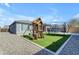 A backyard with artificial turf featuring a playset and trampoline at 797 W Danish Red Trl, San Tan Valley, AZ 85143