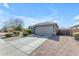 Well-maintained home featuring a concrete driveway and desert landscaping at 797 W Danish Red Trl, San Tan Valley, AZ 85143