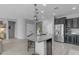 Kitchen island with seating and modern appliances at 797 W Danish Red Trl, San Tan Valley, AZ 85143