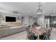 Spacious living room with a dining area showcases modern decor and an open floor plan at 797 W Danish Red Trl, San Tan Valley, AZ 85143