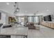 Open concept living space featuring a kitchen island, living and dining area at 797 W Danish Red Trl, San Tan Valley, AZ 85143