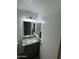 Bathroom featuring a gray vanity with granite countertop, updated fixtures, and a mirrored medicine cabinet at 8101 N 107Th Ave # 26, Peoria, AZ 85345