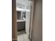Cozy bathroom featuring a gray vanity with granite countertop, stylish fixtures, and wood-look tile flooring at 8101 N 107Th Ave # 26, Peoria, AZ 85345