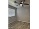 Neutral bedroom featuring wood-look tile flooring and a ceiling fan at 8101 N 107Th Ave # 26, Peoria, AZ 85345