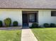 Charming townhome entrance with well-manicured lawn and covered entryway at 8101 N 107Th Ave # 26, Peoria, AZ 85345