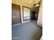 Exterior view of the front door with a window and sidelight on a covered porch at 8101 N 107Th Ave # 26, Peoria, AZ 85345