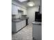 Kitchen featuring granite countertops, white cabinets, and black appliances at 8101 N 107Th Ave # 26, Peoria, AZ 85345