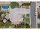 Stunning aerial view of a home with a sparkling pool, lush landscaping, and a large tile roof at 8260 W Cielo Grande Ave, Peoria, AZ 85383