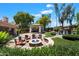 Beautifully landscaped backyard with a fire pit, outdoor seating, and a covered pavilion, perfect for entertaining at 8260 W Cielo Grande Ave, Peoria, AZ 85383
