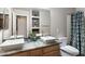 Bathroom with double sinks, granite countertop, and updated fixtures at 8260 W Cielo Grande Ave, Peoria, AZ 85383