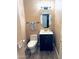 Half-bathroom featuring a modern vanity with oval mirror and updated fixtures at 8260 W Cielo Grande Ave, Peoria, AZ 85383