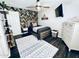 Stylish bedroom featuring a unique accent wall, ceiling fan, and modern decor at 8260 W Cielo Grande Ave, Peoria, AZ 85383