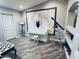 Bright bonus room features built-in shelving, a white piano, and a large map art piece at 8260 W Cielo Grande Ave, Peoria, AZ 85383