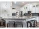 Bright and airy kitchen featuring granite countertops, stainless steel appliances, and white cabinets at 8260 W Cielo Grande Ave, Peoria, AZ 85383