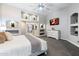 Bright main bedroom featuring decorative alcoves, a ceiling fan, and an en-suite bathroom, combining comfort and luxury at 8260 W Cielo Grande Ave, Peoria, AZ 85383