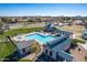 Aerial view of the community pool with gazebo, clubhouse, and surrounding residential area at 85 W Grey Stone St, San Tan Valley, AZ 85143