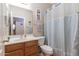 Traditional bathroom featuring a vanity with wood cabinets, and a shower curtain at 85 W Grey Stone St, San Tan Valley, AZ 85143