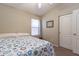 Bedroom with window, a full bed with patterned blanket, and closet with sliding door at 85 W Grey Stone St, San Tan Valley, AZ 85143