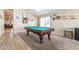 Spacious game room with a pool table, carpeted floor, and ample space for entertaining at 85 W Grey Stone St, San Tan Valley, AZ 85143